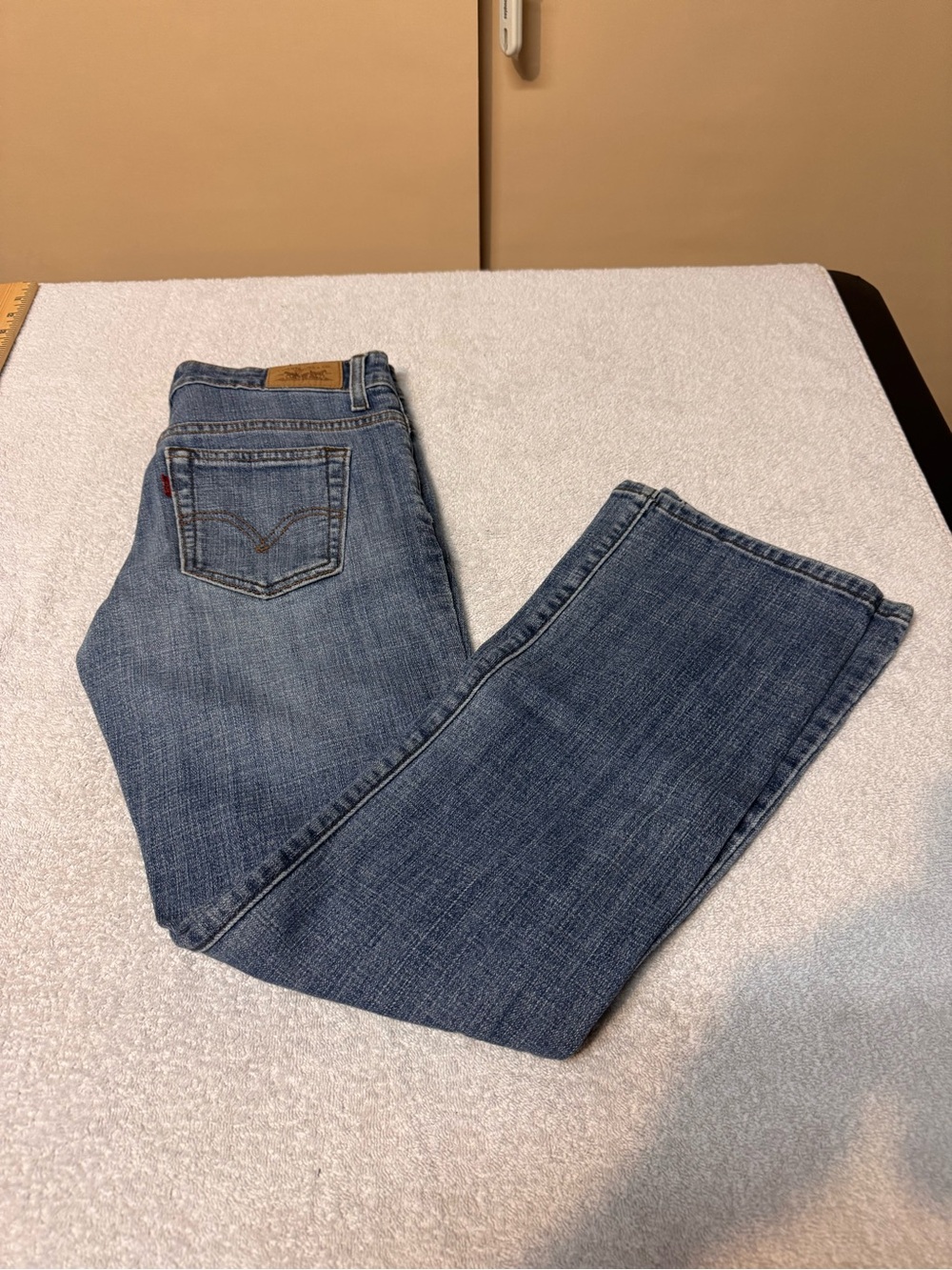 Women’s Levi's Light Blue Boot Cut 515 Jeans with Orange Stitching. Size 2P